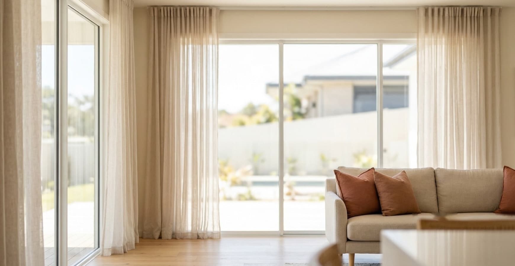Bright living room with sheer curtains filtering natural light